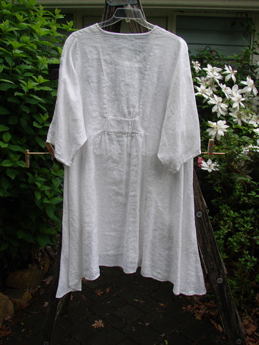 Barclay Linen Side Pocket Tab Tunic Dress in unpainted white, featuring a scooped neckline, curved seams, wider short sleeves, and two drop pockets, reflecting Bluefishfinder.com's vintage, creative style.