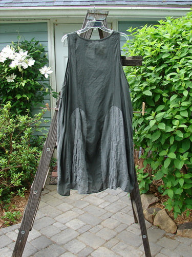 Barclay NWT Batiste Carousel Shift Jumper Unpainted Stripe Slate Size 2 displayed on a wooden ladder, showcasing its sweeping A-line hem, oval neckline, and side cord drawstrings.