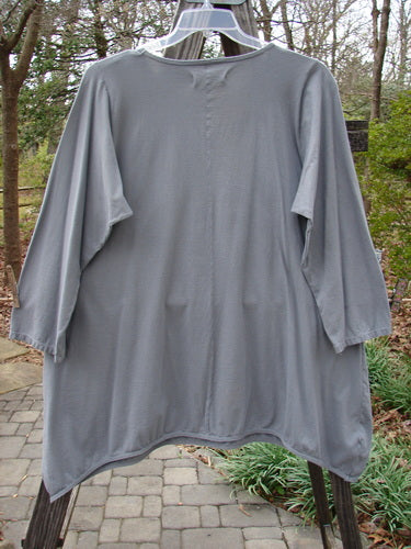 Barclay Long Sleeved Dip Side A Lined Tunic Daisy Logo Grey Storm Size 1 displayed on a mannequin, featuring a rounded neckline, three-quarter sleeves, and a longer, consistent shape.