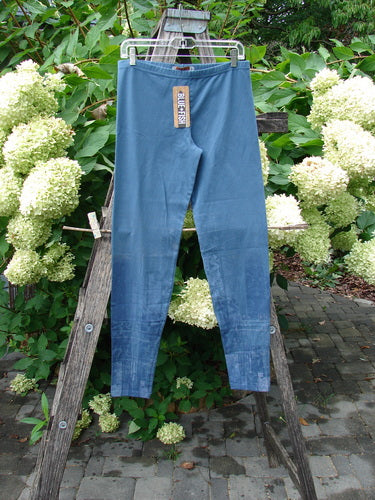 Barclay NWT Cotton Lycra Legging Light Scribe Echo Blue Size 1 displayed on a wooden frame, showcasing a slim fit with elastic waistband and tapering lowers, highlighting the product’s quality and design.