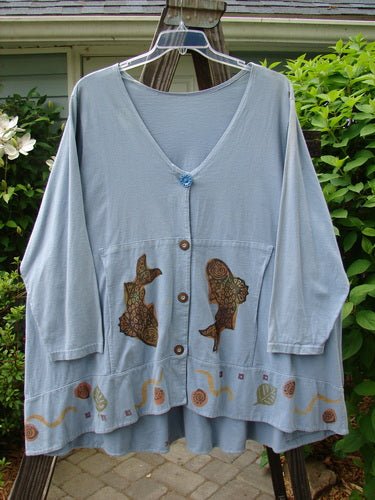 1993 Modernismo Cardigan Koi Periwinkle OSFA featuring fish pattern, classic A-line swing, old-time buttons, and drop pockets. Vintage Blue Fish Clothing from BlueFishFinder.com, emphasizing creativity and individuality.
