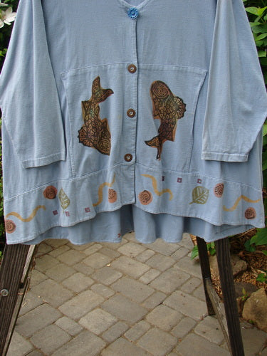 1993 Modernismo Cardigan Koi Periwinkle OSFA: Blue cardigan with koi fish designs, old-time buttons, drop and curved kangaroo pockets, and a thick hemline.