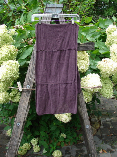 Barclay Gauze Sectional Scarf Wrap Unpainted Deep Burgundy OSFA, displayed as a sleeveless tube-style garment on a ladder; features include sweet finished edges and exterior horizontal seams.