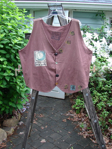 1992 Folk Vest Elements Clove OSFA features a tuxedo front tail, unique scooped back, vintage buttons, and bold detailed paint. Designed with generous measurements for expressive individuality.