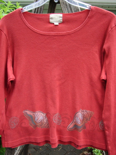 1999 Round Neck Rib Top Seashell Pomegranate Size 2, featuring a ribbed texture, slightly flared hemline, and seashell pattern. Designed for layering with a shorter, boxy silhouette.