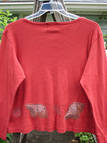 1999 Round Neck Rib Top Seashell Pomegranate Size 2, showcasing a ribbed texture and flared hemline, with seashell-themed paint accents, exemplifying vintage Blue Fish Clothing's creative, expressive style.