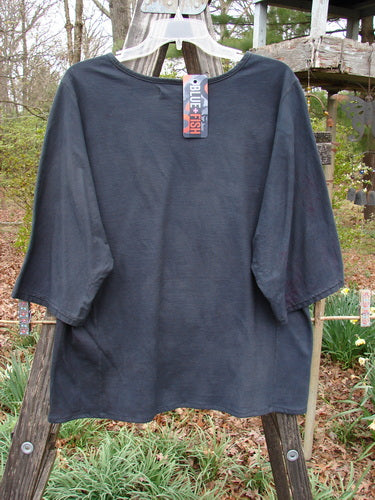 Barclay NWT Three Quarter Sleeved Euro Slim Golden Leaf Mottled Night Dye OSFA displayed on a wooden rack, showcasing its organic cotton fabric and unique design elements.