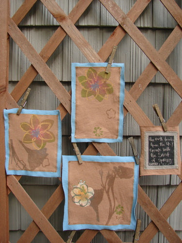 A group of fabric art on a wooden lattice, part of the PMU 2000 Spring Floral Pocket Patch Set Total 5.