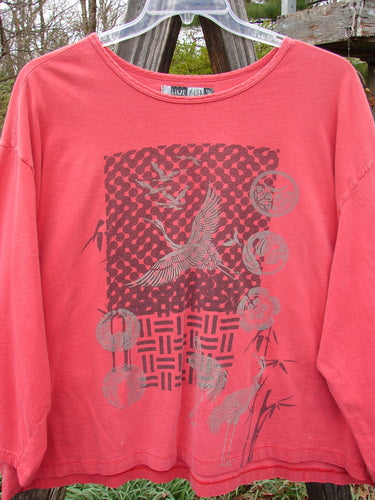 Barclay Long Sleeved Crop Oversized Tee Crane Sherbet OSFA with graphic design, rounded rolled neckline, and wide shape made from mid-weight organic cotton.