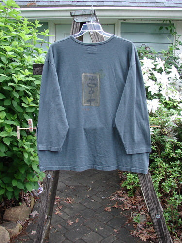 Barclay Long Sleeved Studio Tee Geisha Girl Tealen Size 2 features a straight shape, long sleeves, and rounded neckline with Geisha Girl theme paint, ideal for expressing individuality with vintage flair.