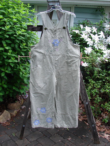 2000 Parachute Overall Pant Jumper Floral Eucalyptus Size 1 features wide painted panels, deep carpenter pockets, and sturdy shoulder straps, embodying BlueFishFinder's vintage, expressive style.