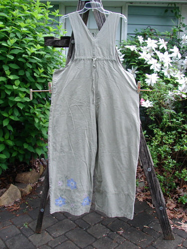 The 2000 Parachute Overall Pant Jumper Floral Eucalyptus Size 1 features oversized painted bib pocket, deep carpenter pockets, sturdy shoulder straps, and wide paneled lowers, embodying vintage Blue Fish Clothing creativity.
