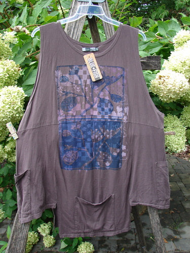Barclay NWT Flower Pot Top Botanicals Brown Sparrow OSFA on hanger outdoors, featuring unique drop front and side pockets, ribbed neckline, sectional panels, and floral-graphic patch, showcasing Bluefishfinder's creative, vintage-inspired style.