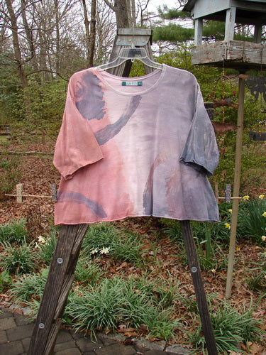 Barclay Three Quarter Sleeved Crop A Lined Tee Wind Mottled Stone Size 2 displayed on a hanger, showcasing its flowing A-line shape, rounded neckline, and sweet curly edges.