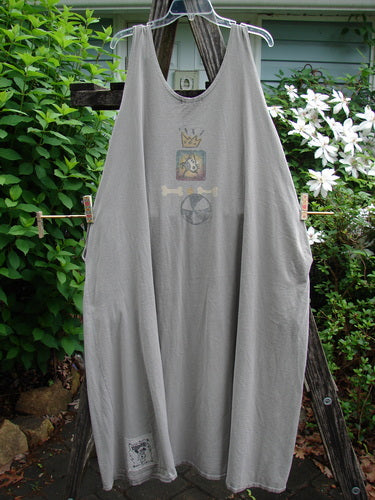 1995 Long Games Smock Jack Russell Pumice OSFA features a sweeping A-line design, rounded neckline, distinct Jack Russell and beach ball paint, dual buttons on shoulders, with inseam pockets and deeper arm openings.