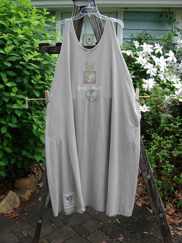 1995 Long Games Smock Jack Russell Pumice OSFA features a sweeping A-line silhouette, rounded neckline, unique Jack Russell and beach ball theme, jet black buttons, and inseam pockets, embodying BlueFishFinder's vintage charm.