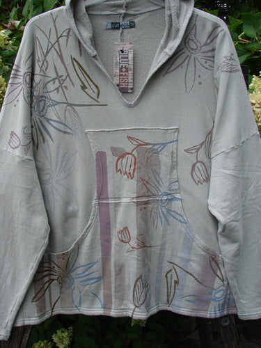 Barclay NWT Fleece Modal Hip To Be Square Hoodie Contour Floral Cloud OSFA: A loose, pale grey-green pullover with floral art, small hood, and kangaroo pocket, reflecting Bluefishfinder.com's vintage bohemian style.