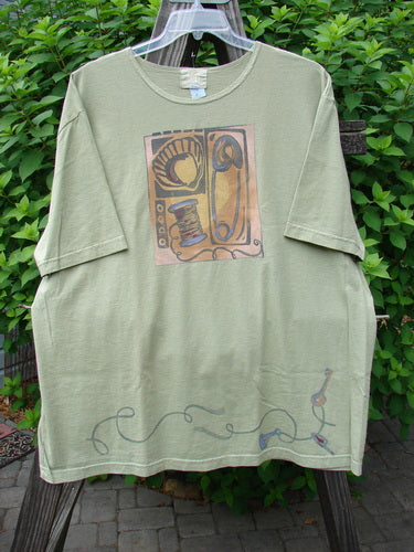2001 NWT Short Sleeved Tee Junk Drawer Kelp Size 2, featuring a detailed drawing print on mid-weight organic cotton, with drop shoulders, wide short sleeves, and Blue Fish logo on the back.