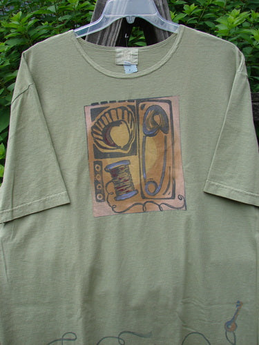 2001 NWT Short Sleeved Tee Junk Drawer Kelp Size 2, featuring a detailed drawing on mid-weight organic cotton with drop shoulders, wide short sleeves, and a Blue Fish logo on the back.
