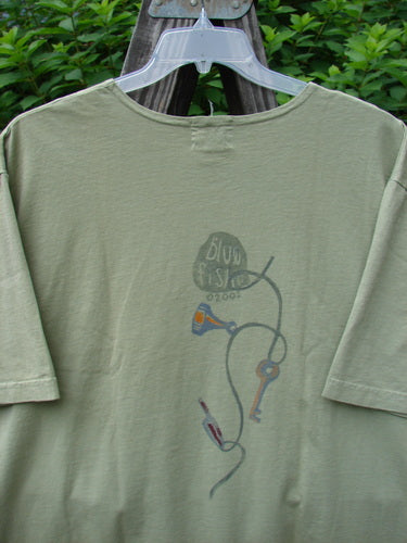 2001 NWT Short Sleeved Tee Junk Drawer Kelp Size 2 featuring a detailed junk drawer theme paint with drop shoulders, wide short sleeves, and a Blue Fish logo stamp on the back.