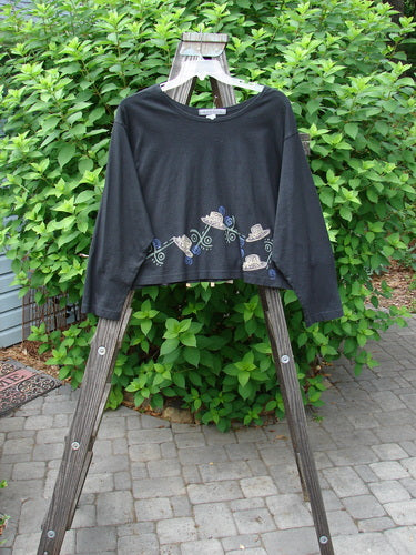 1997 NWT Long Sleeved Crop Tee Top Hat Ebony Size 2 displayed on a wooden rack, featuring a wide, slightly A-lined crop shape, drop shoulders, and a bright blue patch.
