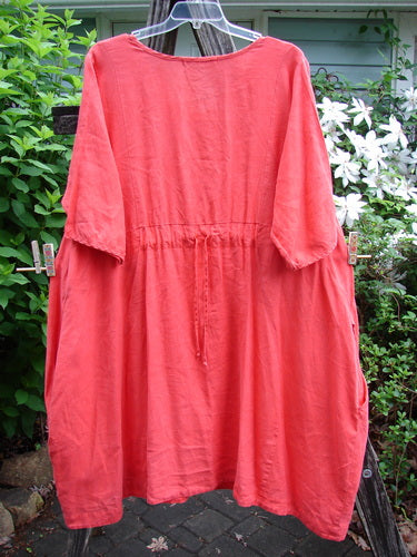 Barclay Linen Pleated Pocket Swing Dress Unpainted Geranium Size 2, featuring wide pleats, a slightly dipped neckline, and super low inseam pockets, showcasing a vintage-inspired baby doll shape from Bluefishfinder.com.