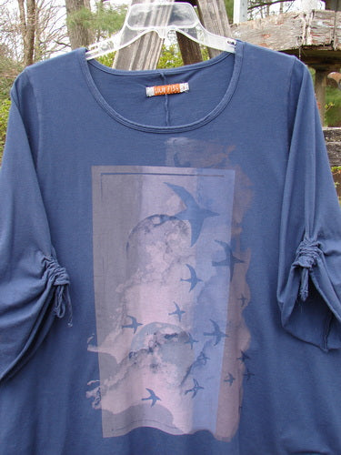 Barclay Draw Sleeve Cafe Tunic Moon Gull Denim Size 1, featuring a rounded neckline, A-line shape, long sleeves, and unique moon gull theme paint.