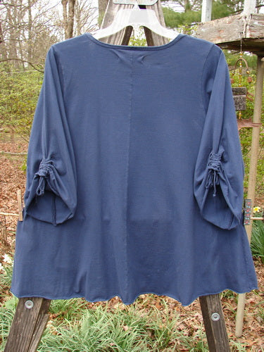 Barclay Draw Sleeve Cafe Tunic Moon Gull Denim Size 1 displayed on a clothes rack, showcasing its rounded neckline, swinging A-line shape, long wide sleeves, and rolled edgings.