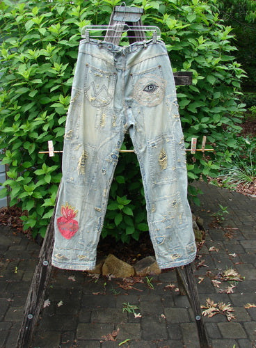 Magnolia Pearl NWT Guadalupe Love Ranchero Miner Jean in Washed Indigo showcases distressed edges, rear embroidery, patching, adjustable buckle, button fly, and dual pockets, reflecting BlueFishFinder's vintage, expressive style.