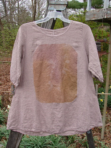 Barclay Linen Lucida Top Whisper Wheat Sprig Mauve Size 0 displayed on a hanger, featuring a rounded neckline, slightly smaller back shoulder line, flowy A-line shape, and almost three-quarter length sleeves.