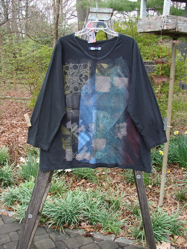 Barclay NWT Long Sleeve Studio Tee Mixed Metallic Mosaic Black Size 0 displayed on a hanger, showcasing its unique pattern and three-quarter sleeves.