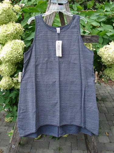 Barclay NWT Light Weight Chambray Shift Stripe Denim Dark Size 0, featuring a sleeveless scoop-neck design with a varying hem and deeper arm openings, hangs on a rustic ladder against a natural backdrop.