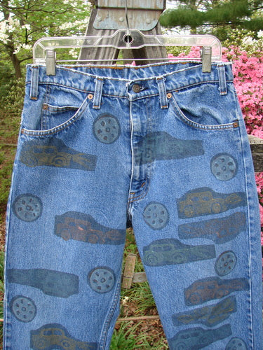 1995 Levi Strauss & Co Denim Blue Jean Travel Dark Stone Wash Size 1 featuring colorful car prints, signature blue fish patch, two front and two rear pockets with Levis tag, buttoned zip fly.