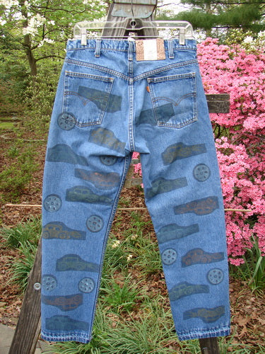 1995 Levi Strauss & Co Denim Blue Jean Travel Dark Stone Wash Size 1, featuring cars and travel theme paint, standard belted zip fly, front and rear pockets, and specialized blue fish patch.