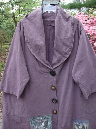 1994 Reprocessed Carriage Jacket Star Moon Fuji Purple Altered OSFA displayed on a hanger, featuring a billowy collar, oversized buttons, pleated shoulders, and varying hemline with deep side pockets.
