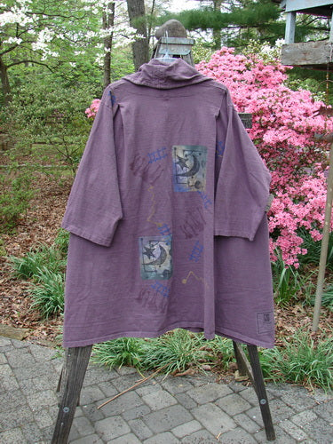 1994 Reprocessed Carriage Jacket Star Moon Fuji Purple Altered OSFA displayed on a wooden stand, featuring a wide billowy collar, oversized buttons, and pleated shoulders for a fitted look.