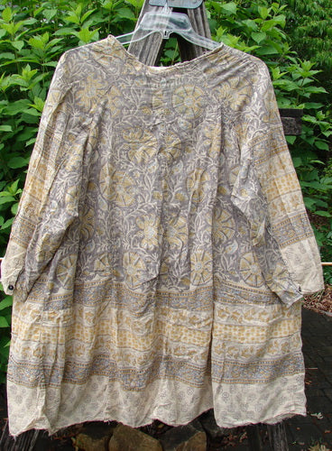 Magnolia Pearl European Cotton Block Print Briar Tunic Top Flower Child OSFA features a soft, flowing A-line shape with raw edges, Henley snap buttons, and dual inseam side pockets, embodying a unique vintage aesthetic.