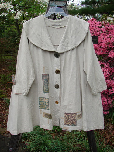 1994 Wanderer's Jacket Mindful Mosaic Mist Altered Size 1 featuring a wide shawl collar, stitched shoulder folds, and sectional side inserts for flair and movement.