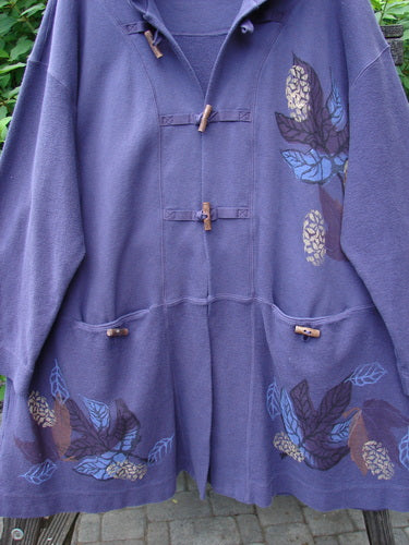 1998 Berber Hooded Bracken Jacket Midnight Leaf Size 2 featuring a floral design, toggle buttons, sectional pocketed panels, and a hood, crafted from heavy-weight cotton berber, perfect for fall.