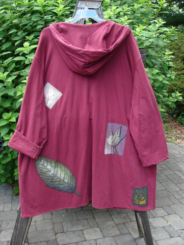 1998 Patched Autumn Coat Fall Leaf Madder OSFA featuring a hood, ceramic buttons, foldable cuffs, oversized leaves patches, and signature Blue Fish patch, showcasing a unique drape and swing.