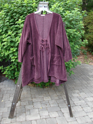 Barclay Chenille Rippie Tie Front Robe Jacket Unpainted Murple Size 2 displayed on a rack, highlighting its double drop front pockets, varying hemline, and smooth vertical cotton paneling.