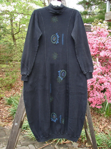 1996 Thermal Day Dress Abstract Black Size 0 displayed on a wooden stand, featuring ribbed cuffs and hemline, a mock rib t-neck, vertical seams, and an abstract painted pattern.