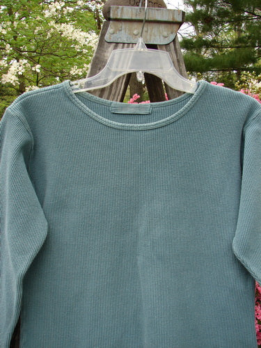 1997 Thermal Long Sleeved Top Unpainted Cypress Size 1 displayed on a swinger, showcasing a thick cotton thermal fabric with continuous neckline stitchery and a slightly tapered waistline.