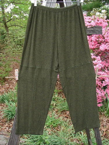 2000 Rayon Lycra Rib Quadrant Pant Unpainted Green Oak Heather Size 0, displayed draped over a wooden fence, showcasing its cropped boxy shape and full elastic waistline.