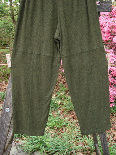 2000 Rayon Lycra Rib Quadrant Pant in Unpainted Green Oak Heather Size 0 displayed on a metal stand, highlighting its full elastic waistline, shorter inseam, and unique cropped boxy shape.