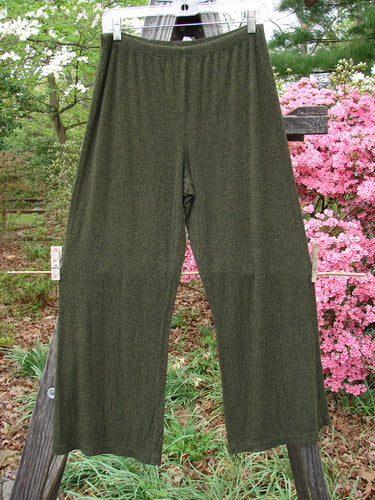2000 Rayon Lycra Rib Flare Pant Unpainted Green Oak Heather Size 1 hanging on a clothesline, showcasing its full elastic waistline, slightly flared bottom, and superior drape.