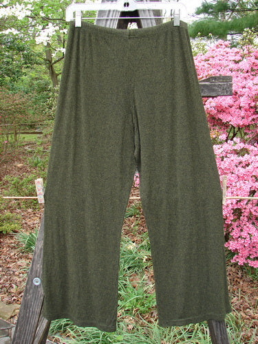 2000 Rayon Lycra Rib Flare Pant Unpainted Green Oak Heather Size 1 displayed draped over a wooden fence, highlighting its full elastic waistline and slightly flared bottom.
