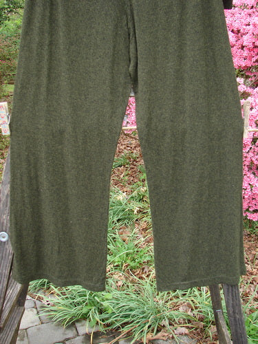 2000 Rayon Lycra Rib Flare Pant Unpainted Green Oak Heather Size 1 displayed draped over a wooden fence, highlighting its full elastic waistline, slightly flared bottoms, and superior drape.