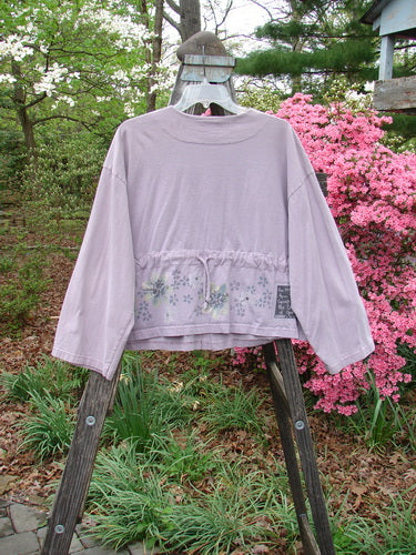 2000 Wide Crop Jacket Dance Flower Hyacinth Size 0 displayed on a wooden ladder, showcasing its A-line flair, variegated buttons, and distinctive downward curved rear drawcord.