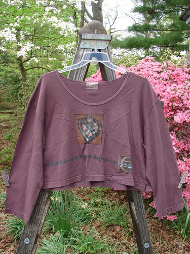 2000 Kell's Top Celtic E Loam Size 1 displayed on a hanger, featuring a boxy shape, signature Blue Fish patch, and a flatter neckline with a deeper scoop.